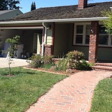 a house with a brick walkway leading to it