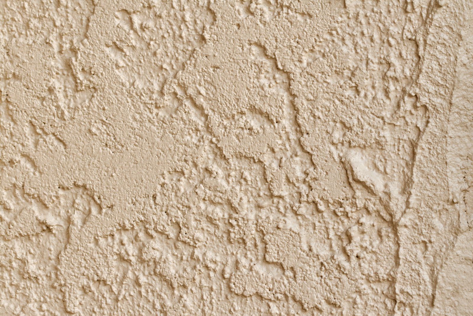 Textured beige stucco wall.