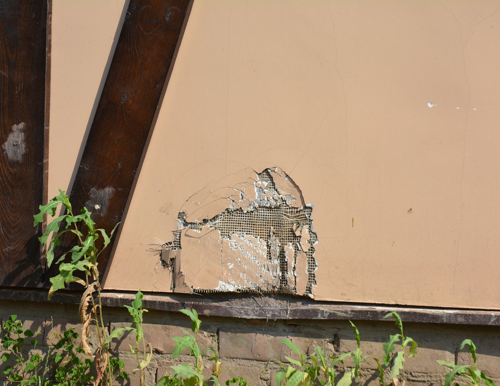 A close up of a wall with a hole in it