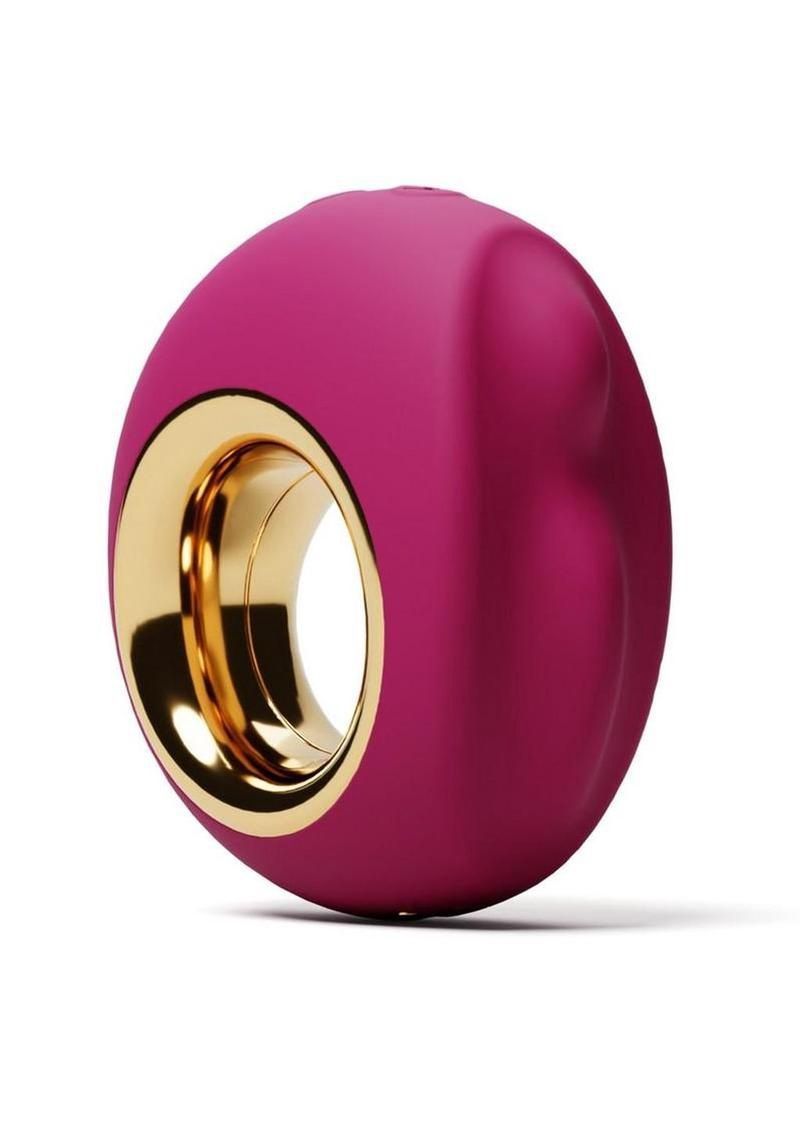 Magenta and gold glossy ring-shaped object on a white background