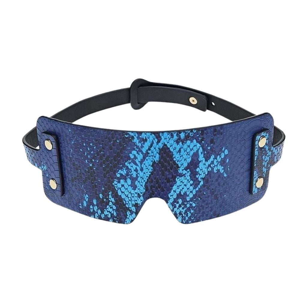 A blue and black snakeskin-patterned sleep mask with adjustable straps and gold-toned metal accents.