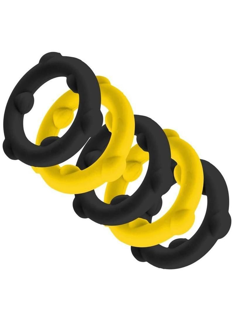 Four textured rings in alternating black and yellow colors arranged in a diagonal line.