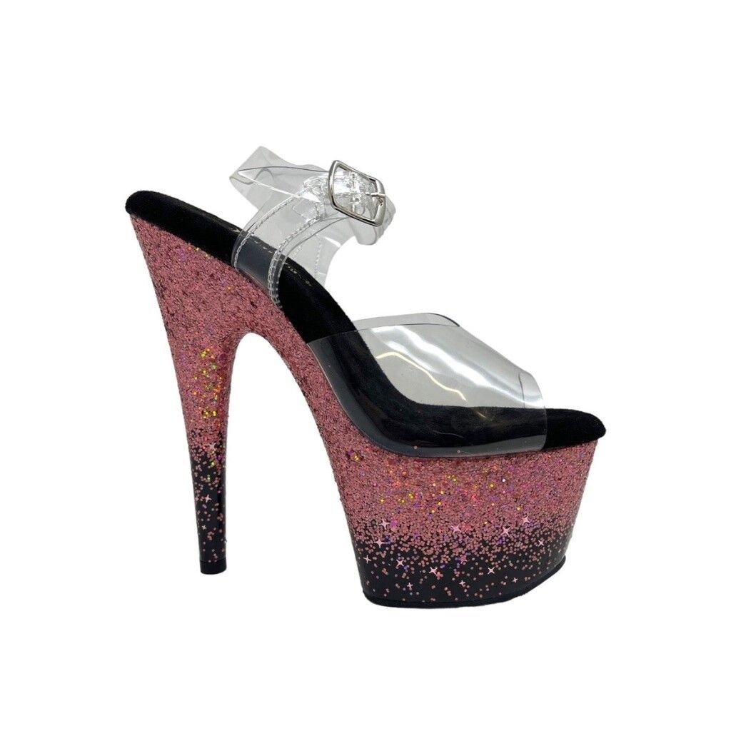 Pink glitter platform high-heeled sandal with clear straps and buckle, black heel, white background.