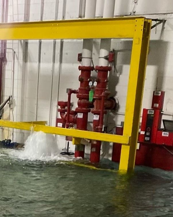 Emergency plumber response to industrial water leak and fire sprinkler flooding

