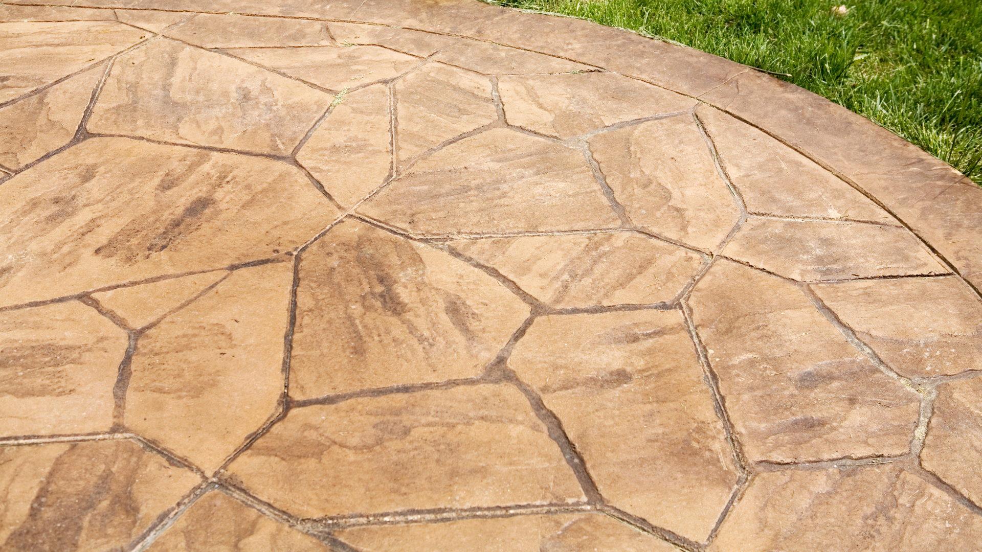 A close up of a concrete patio with a geometric pattern.