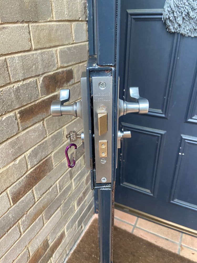 A Door Lock On A Brick Wall — Fortress Locksmiths & Security in Castle Hill, NSW