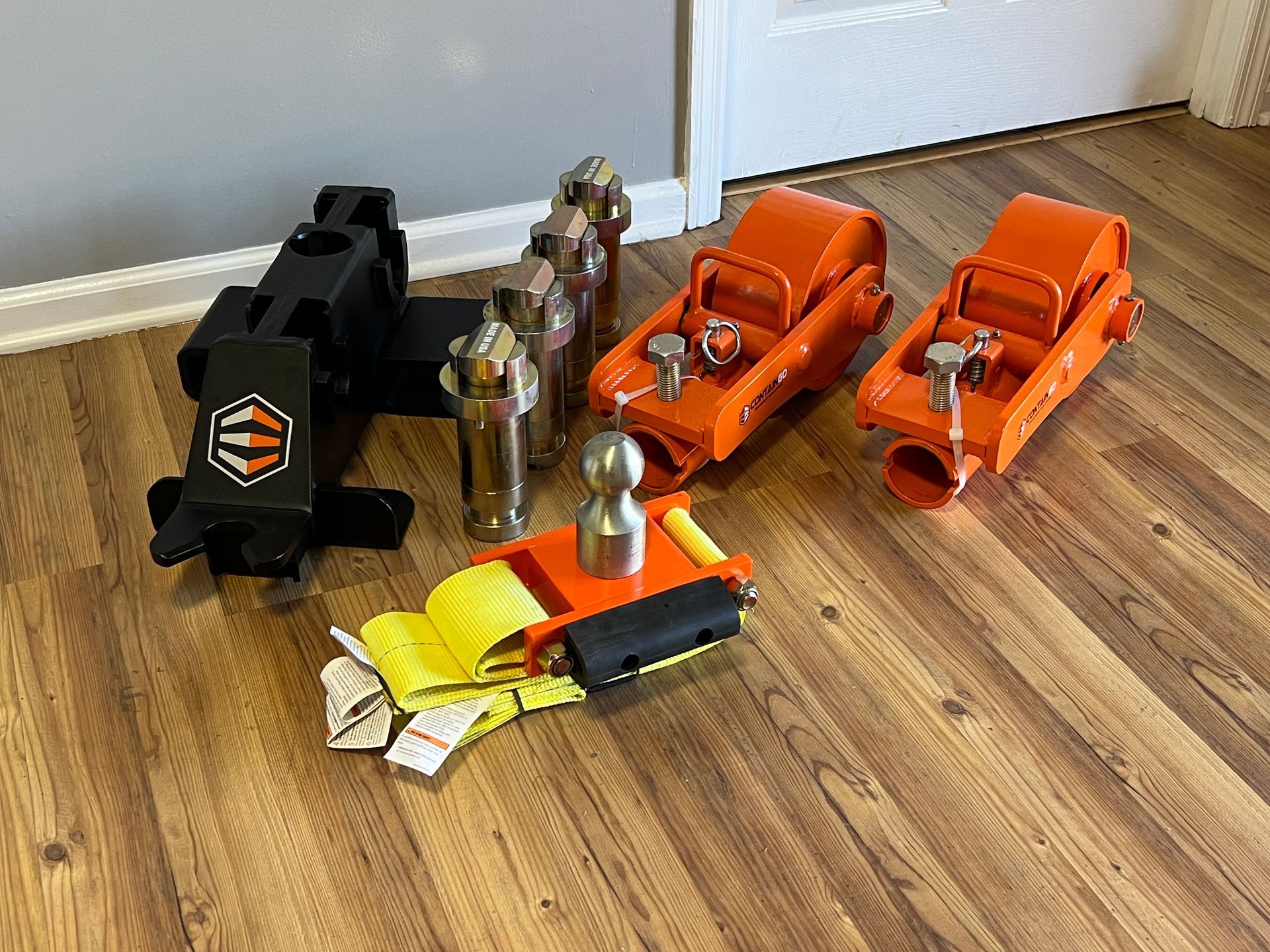 the individual parts of the container relocation kit are displayed sitting on a floor