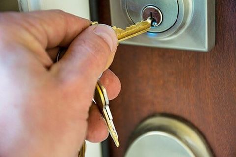 Lock Out Services — Man's Hand Unlocking the Door in Encinitas, CA