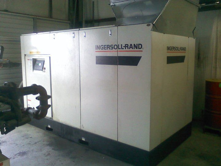 A ingersoll rand machine is sitting in a garage