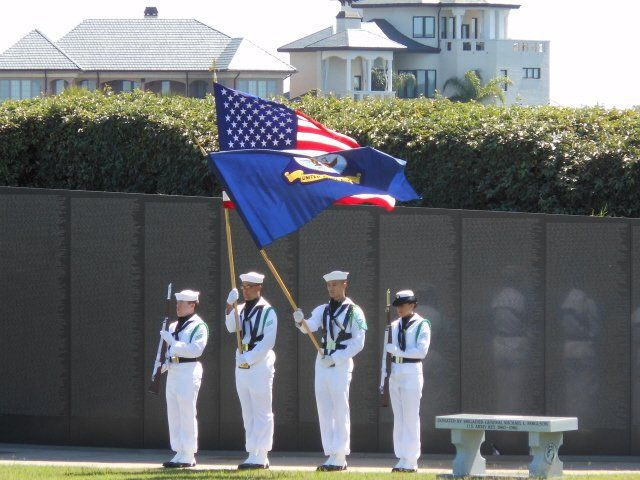 military men holding flags