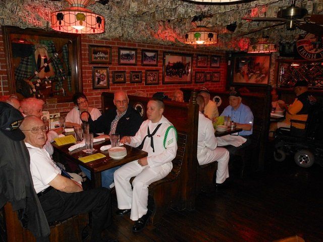 sailors eating at a restaurant