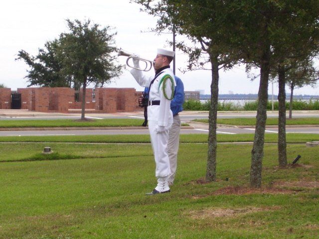 serviceman playing trumpet