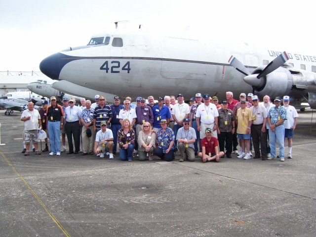 tour group in front of plane