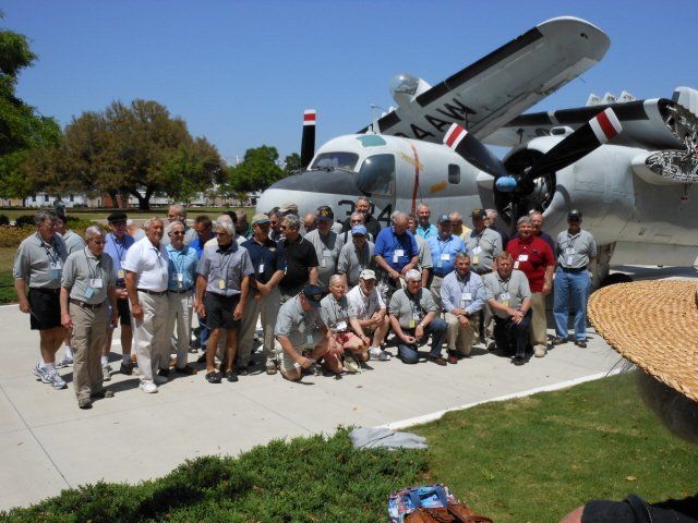 tour group in front of plane