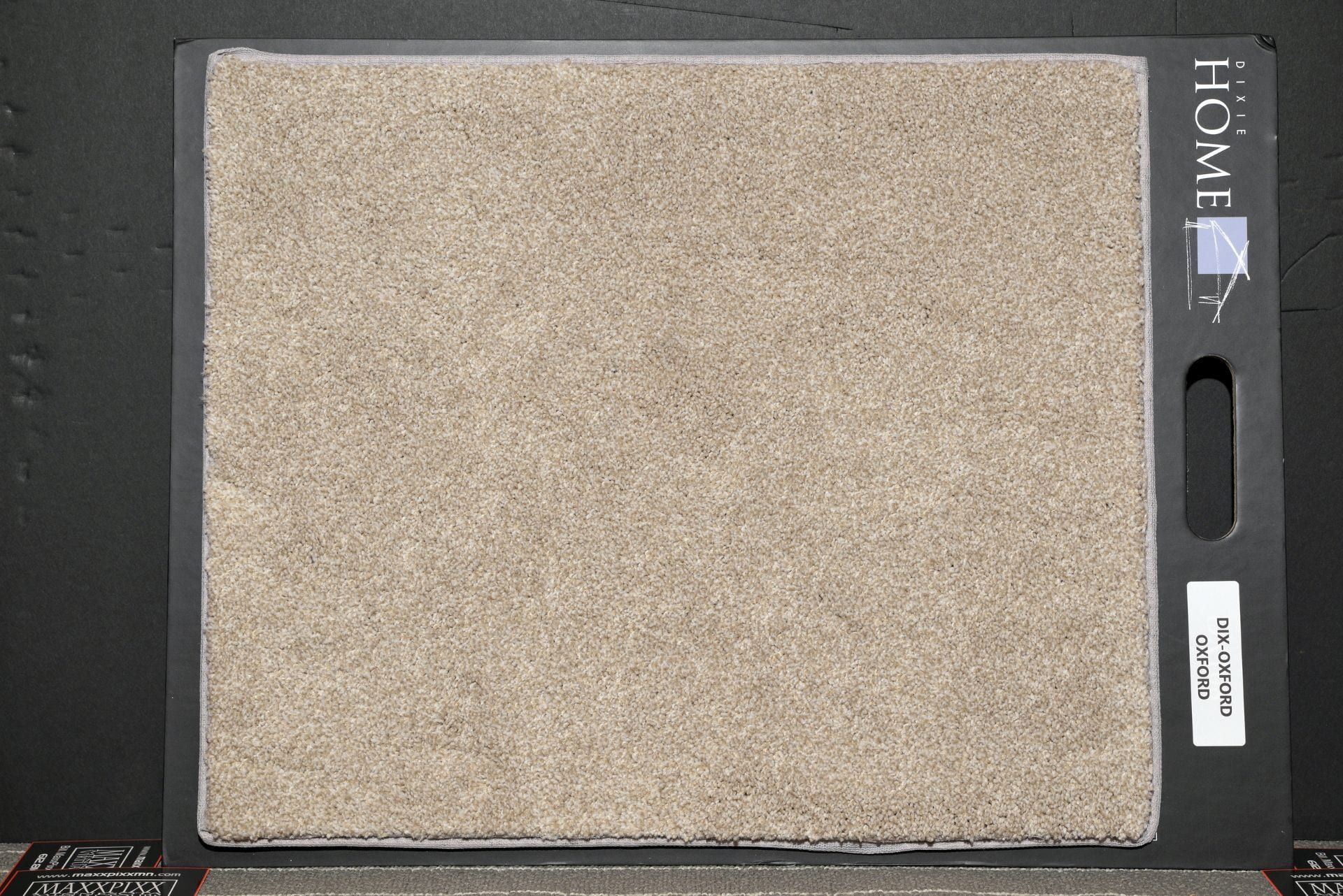 A piece of carpet is sitting on top of a display board.