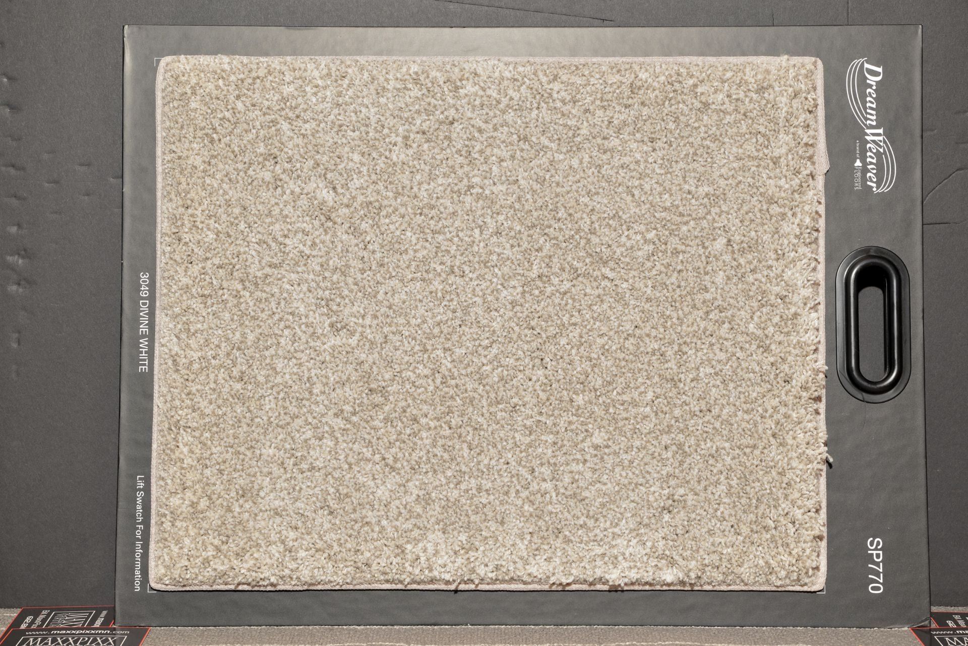 A piece of carpet is sitting on top of a black table.