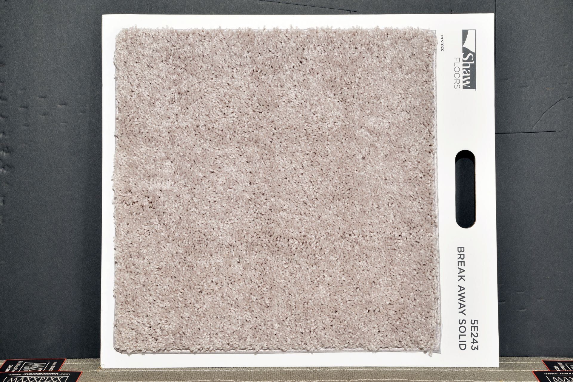 A piece of carpet that says dream lake beige on it