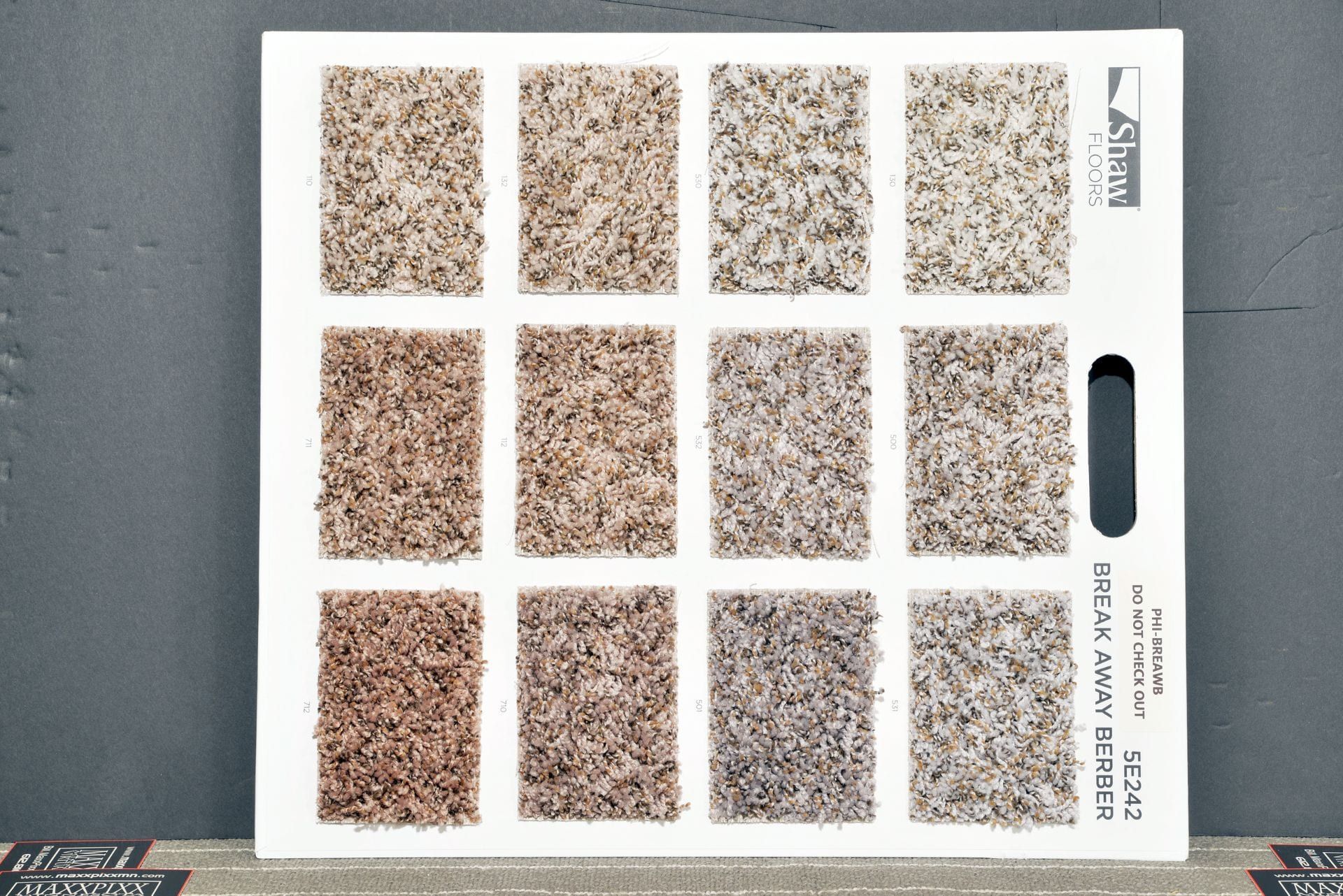 A carpet swatch display shows a variety of colors