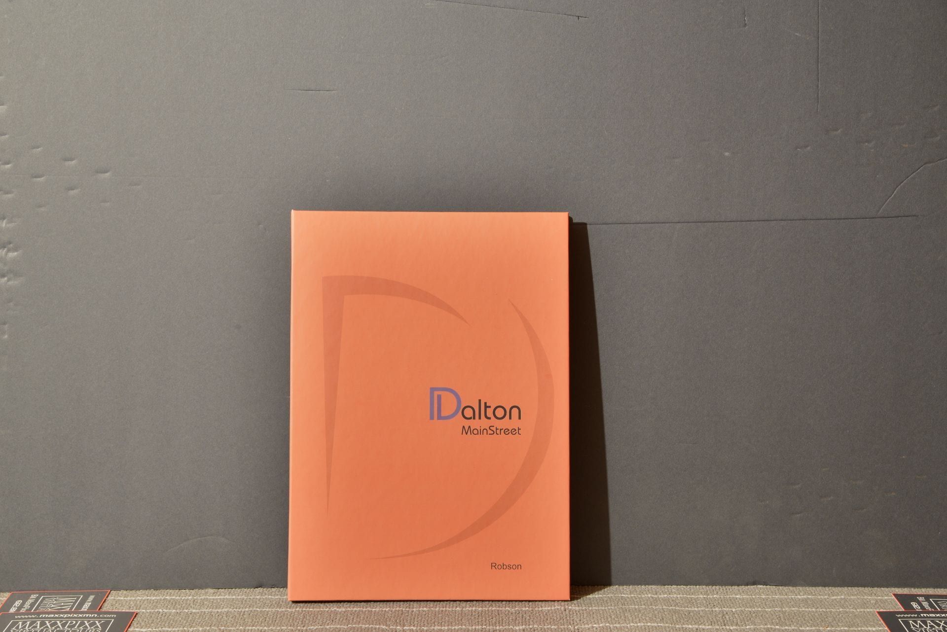 A book titled dalton is sitting on a table