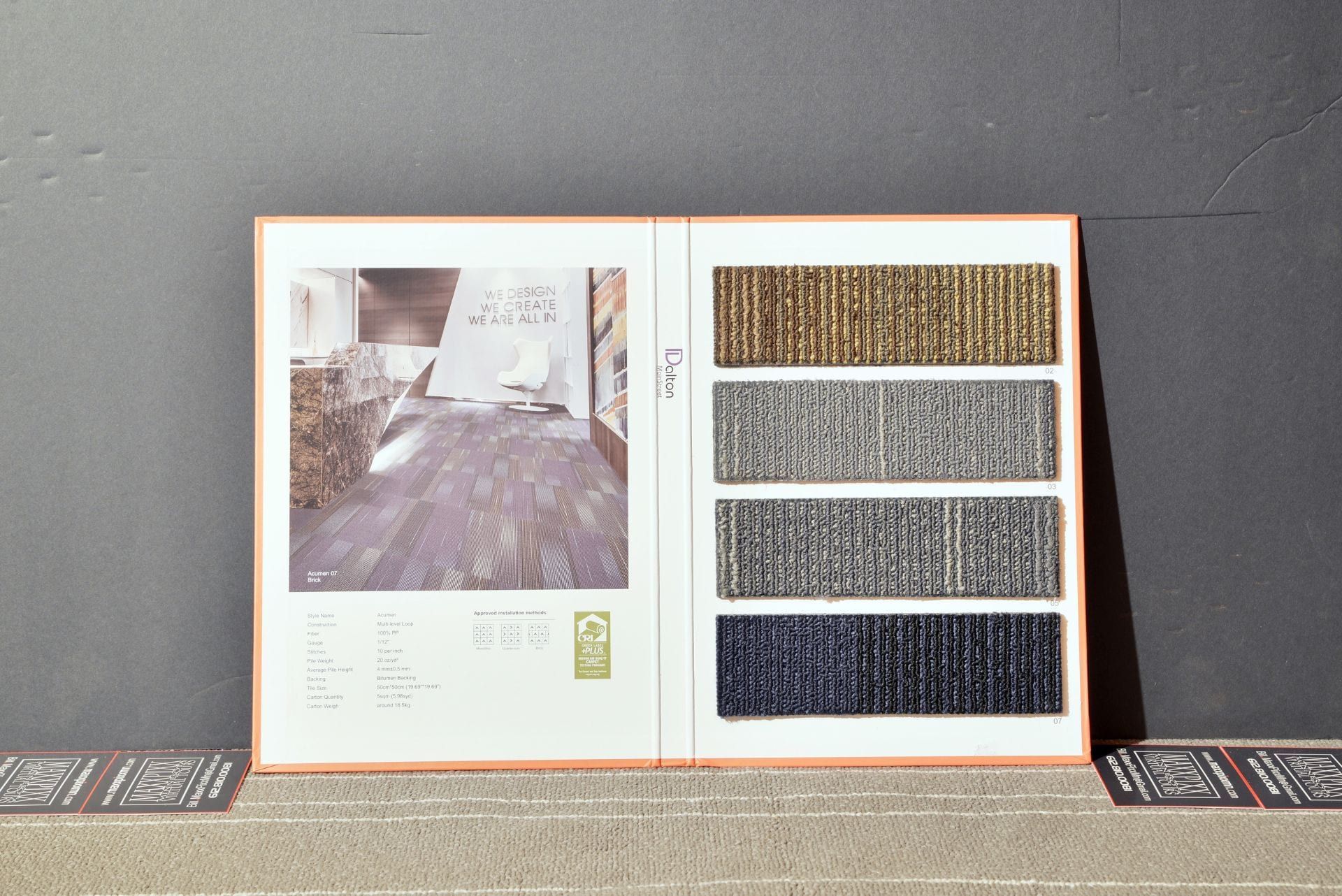 A book is open to a page showing different types of carpets