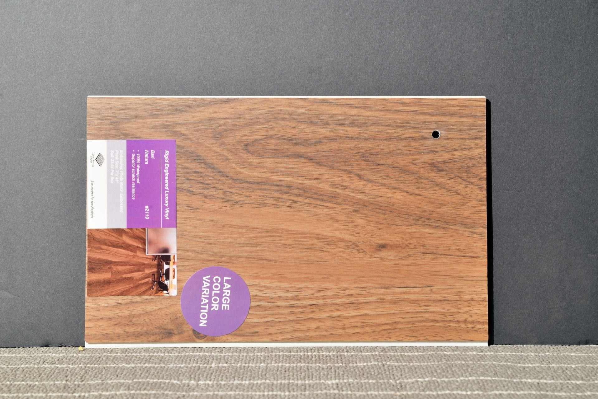 A piece of wood with a purple label that says interior light