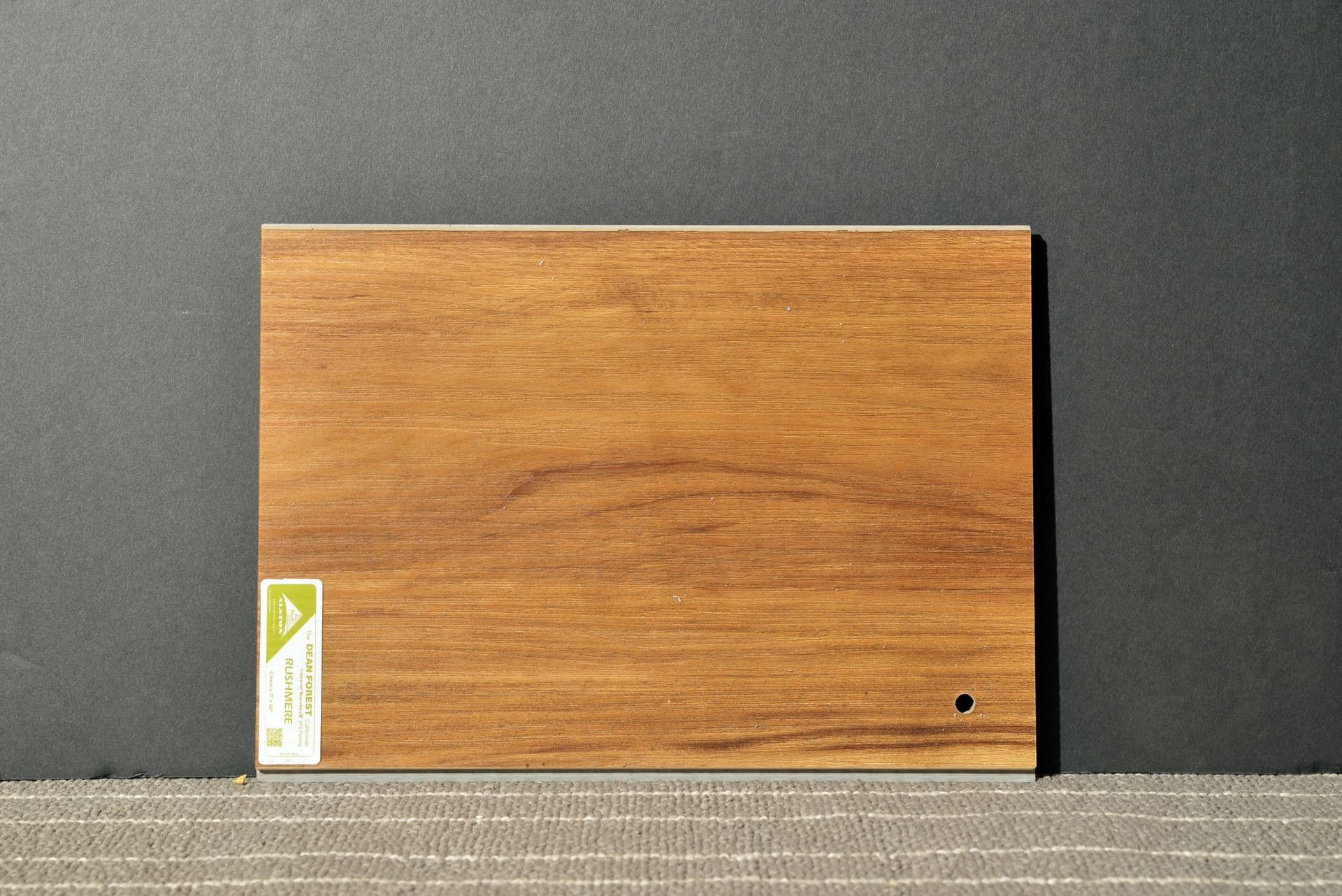 A piece of wood with a hole in the middle of it