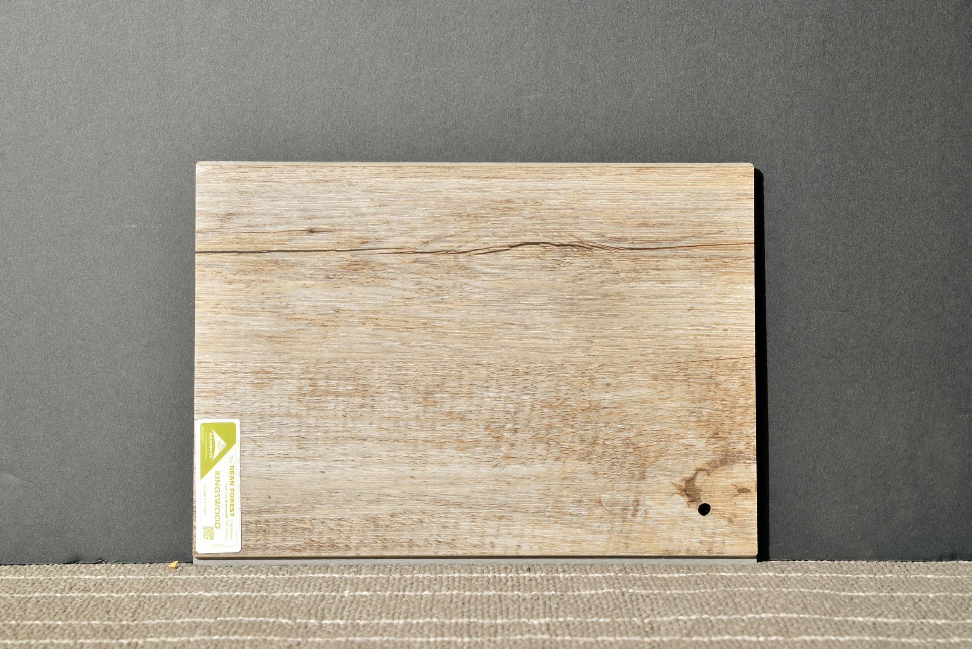 A small piece of wood with a label on it