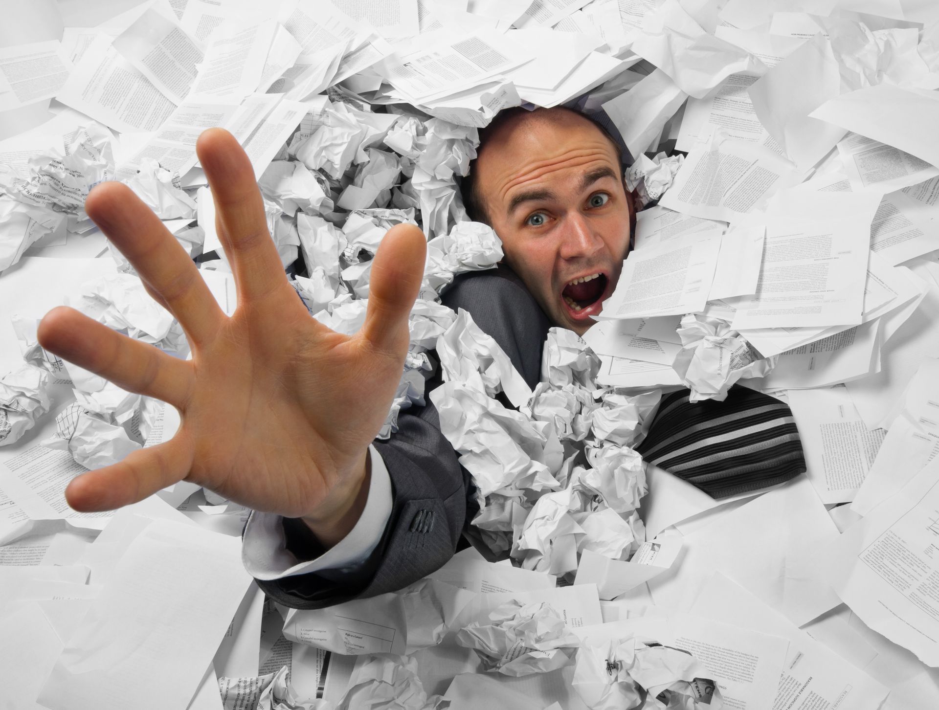 Businessman overwhelmed by paperwork