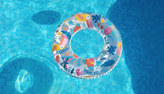 An inflatable ring is floating in a swimming pool.
