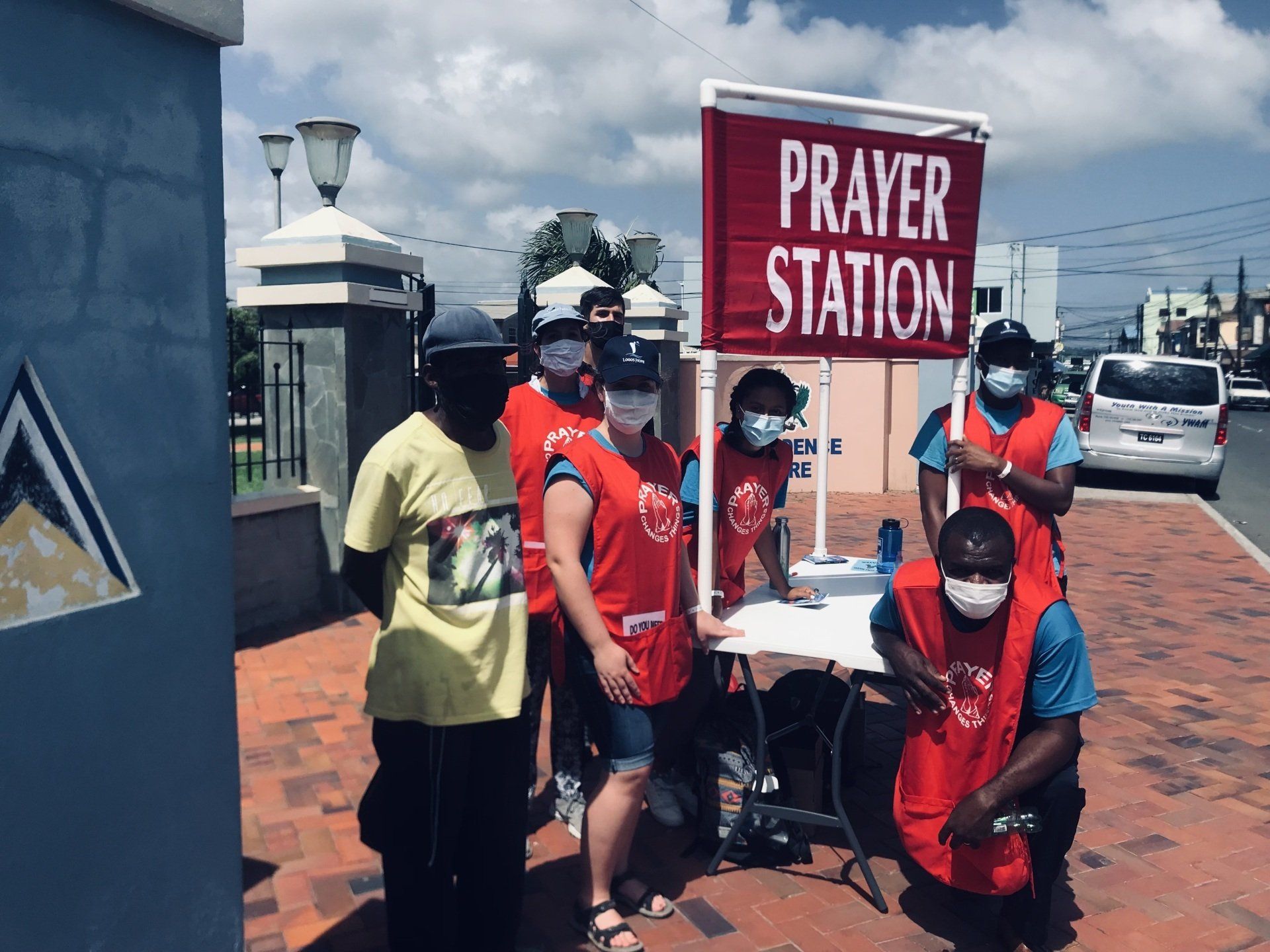 A group of people standing around a prayer station