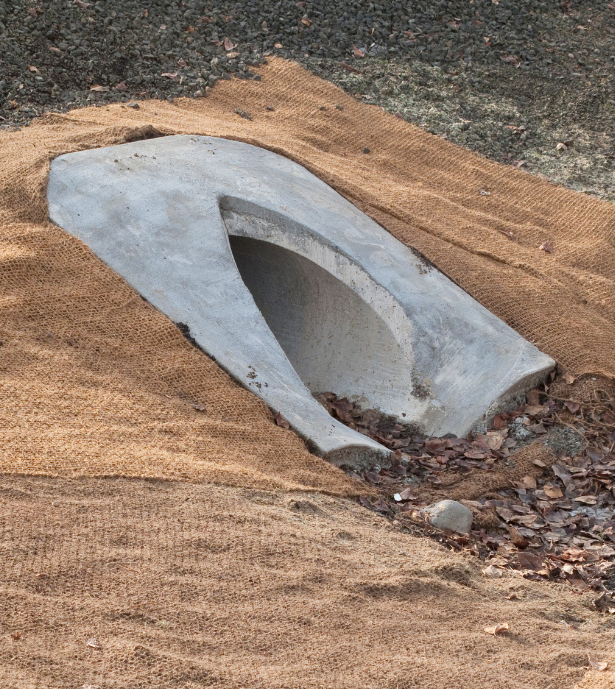 a concrete culvert in the ground