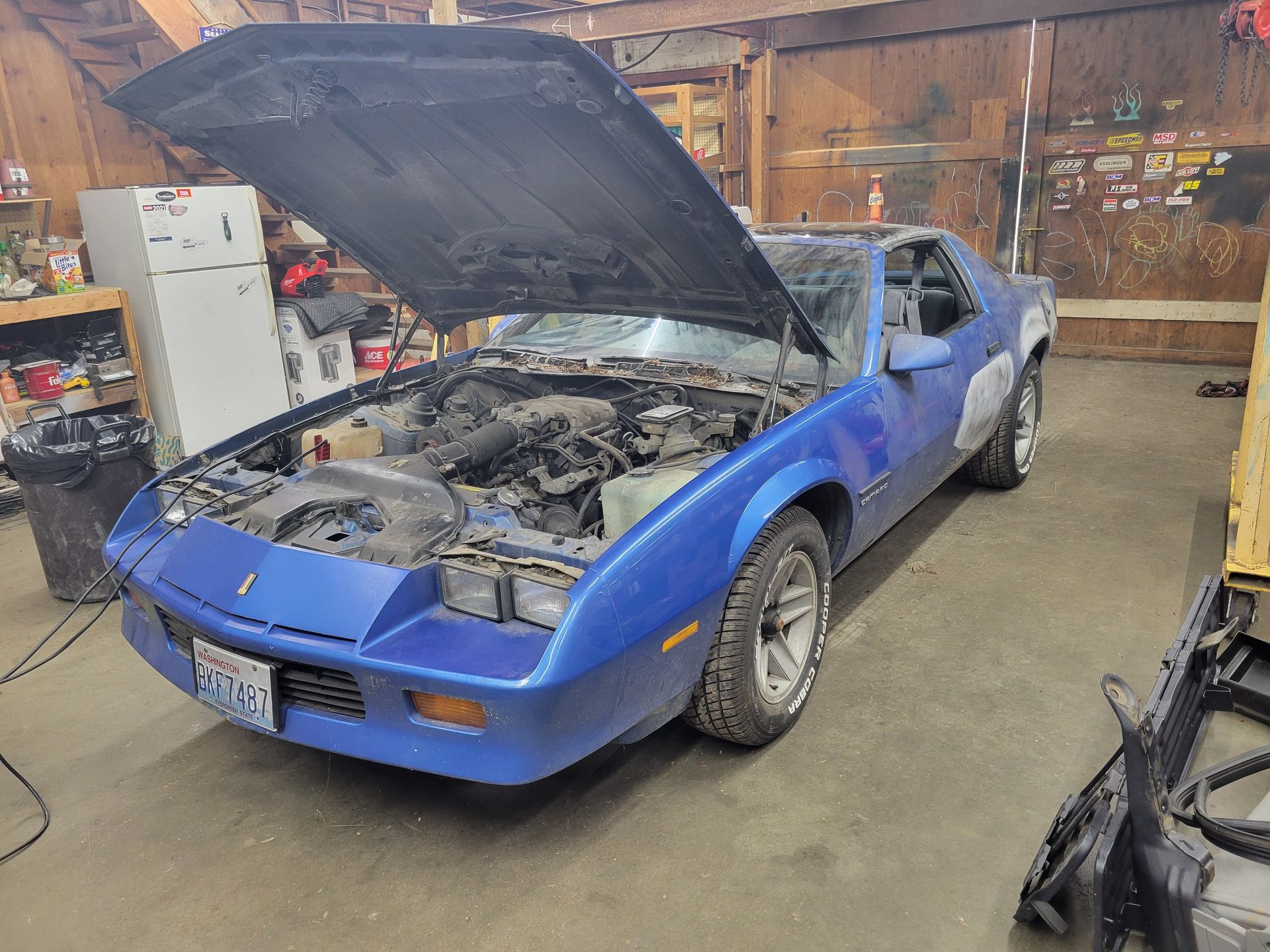 Blue classic car, hood open, in a garage. Bodywork in progress. | Countryside Automotive