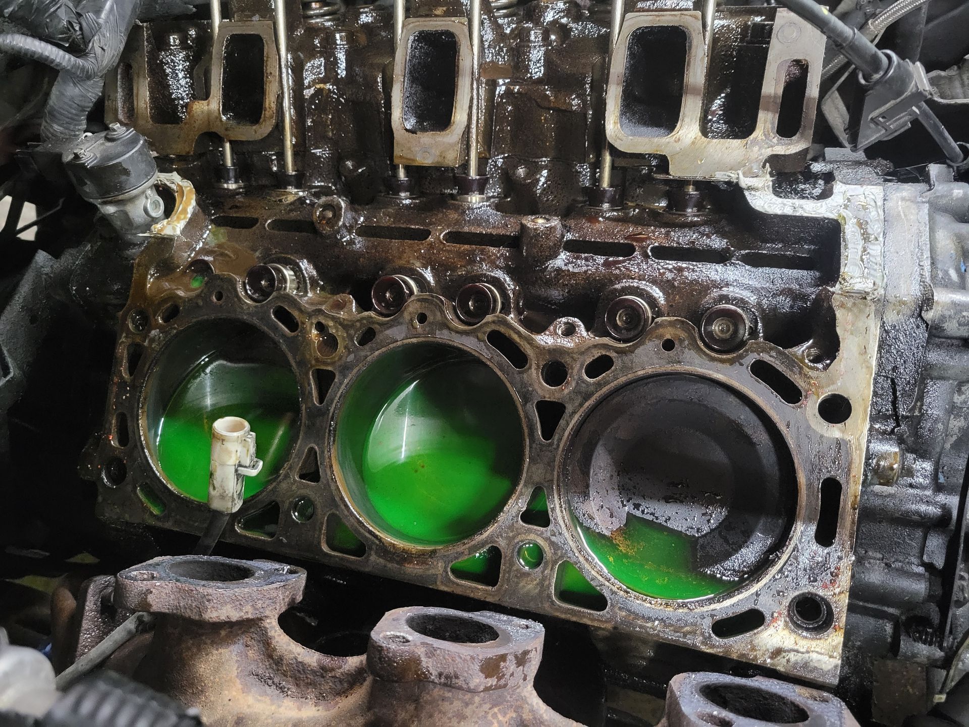 Engine block with coolant visible in cylinders. | Countryside Automotive
