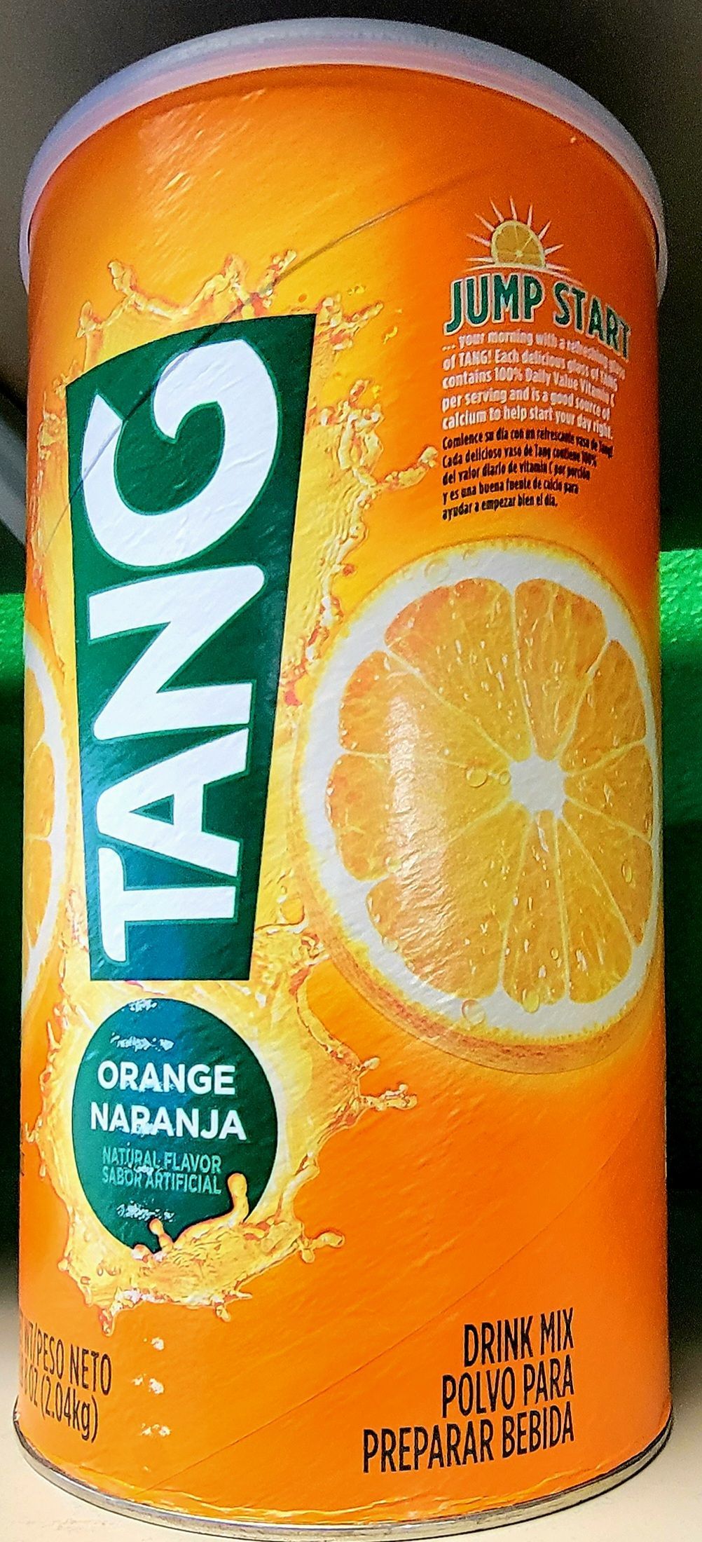 A cylindrical container of Tang orange drink with orange and white branding.