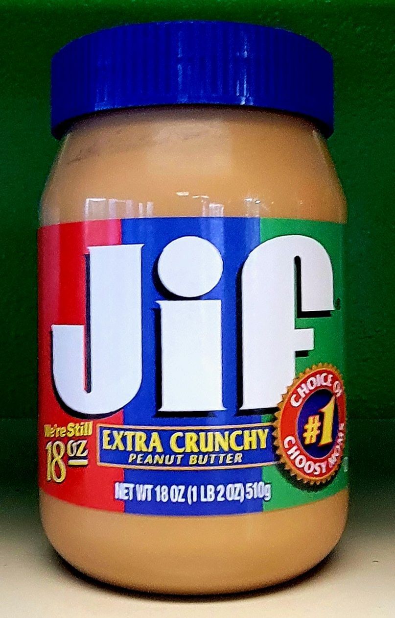 Jar of Jif Extra Crunchy peanut butter with a blue lid.