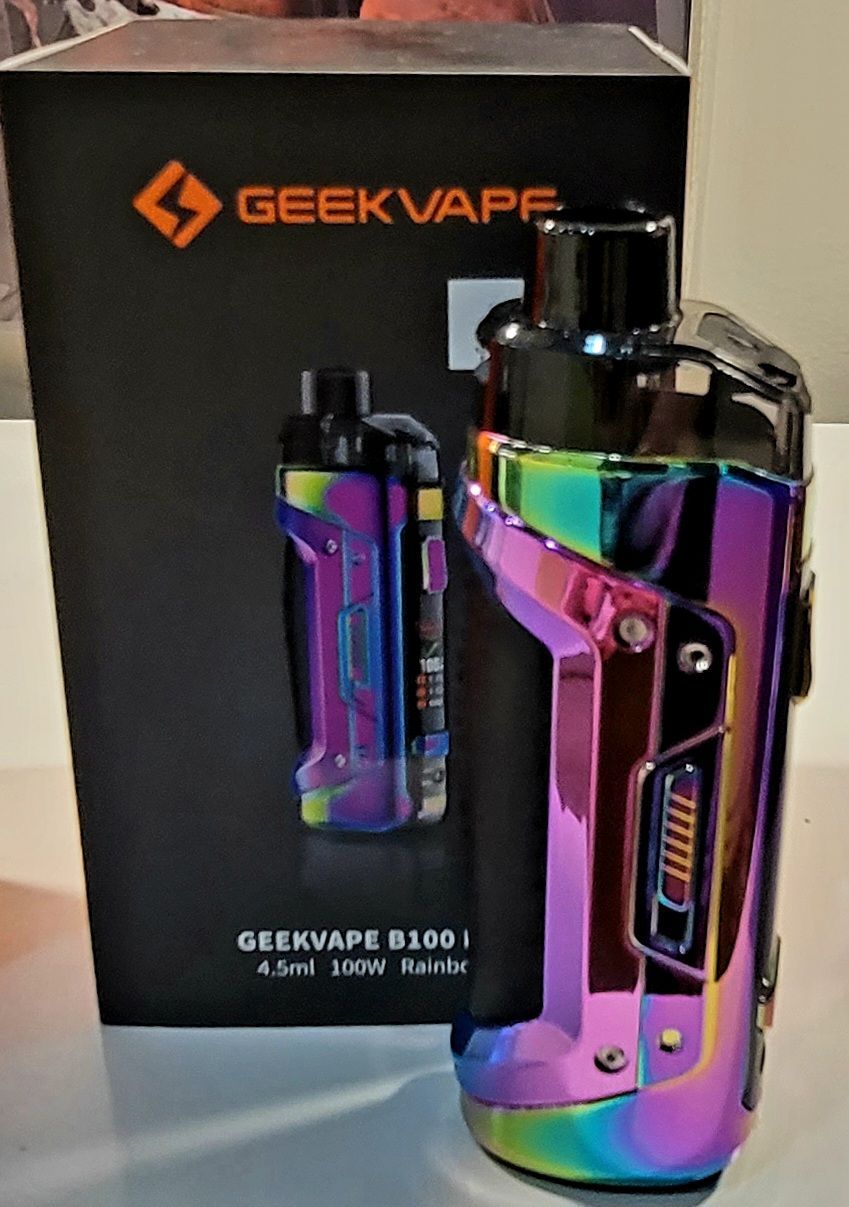 Geekvape B60 vape in iridescent finish next to its box, both showing the device.