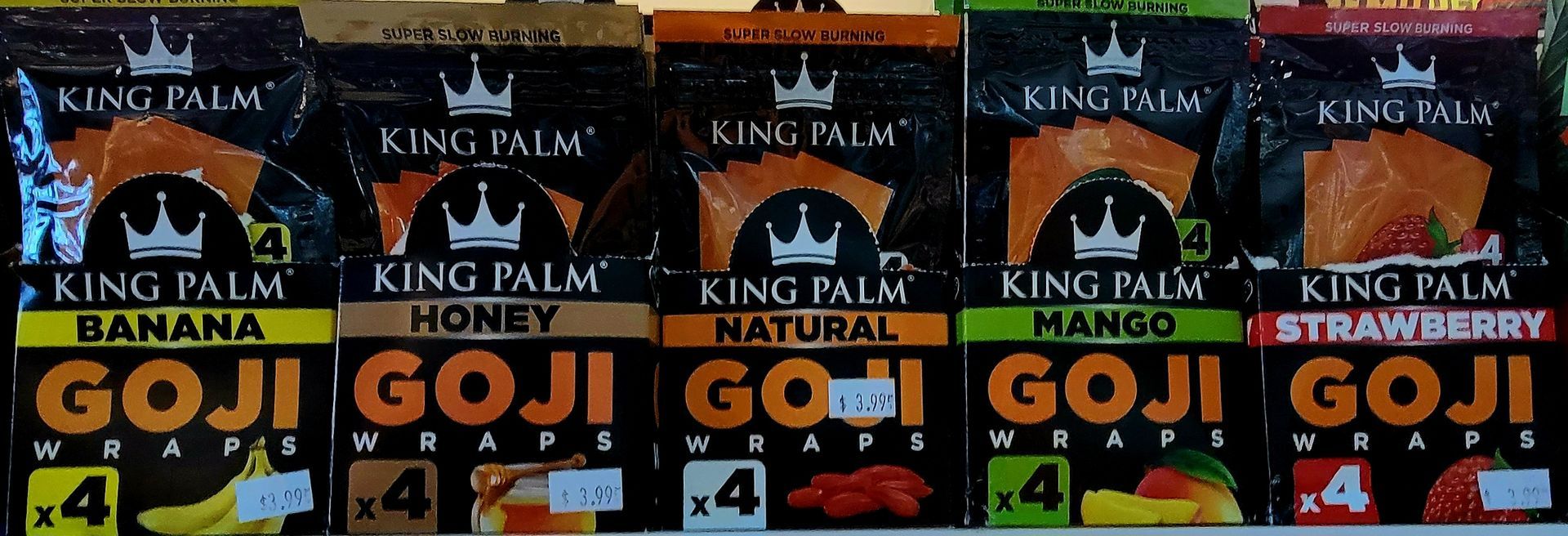 Row of King Palm Goji wraps in banana, honey, natural, mango, and strawberry flavors.
