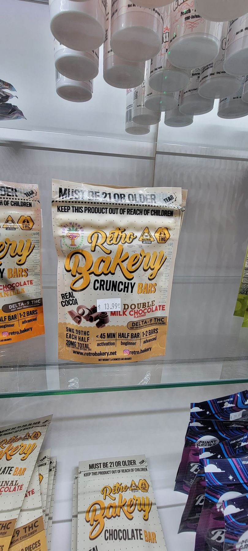 A shelf with bags of 