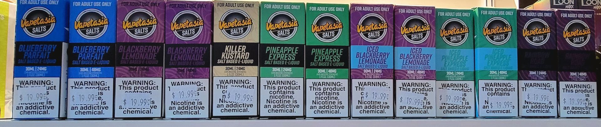 A collection of small boxes, with colorful tops and text, arranged in a row.