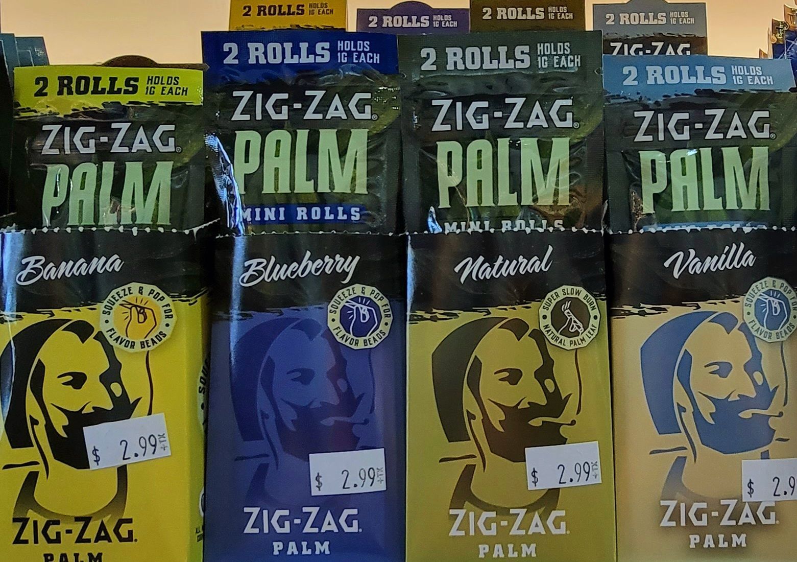 Display of Zig-Zag Palm rolling papers in various flavors: banana, blueberry, natural, and vanilla.