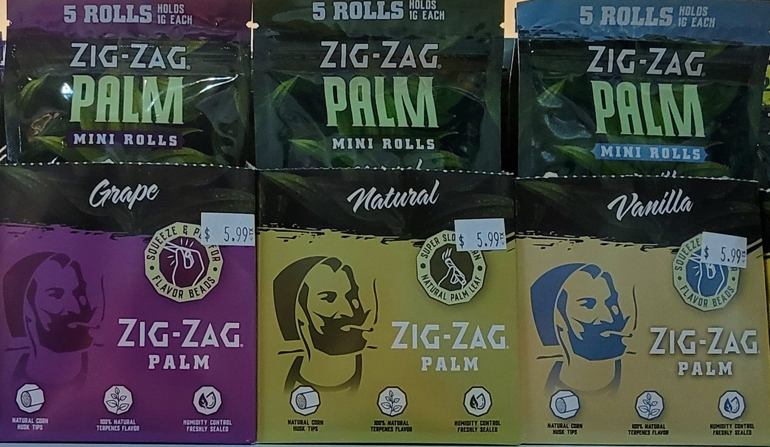 Zig-Zag Palm mini rolls: Grape, Natural, and Vanilla flavors, displayed in rows, with green and colored packaging.