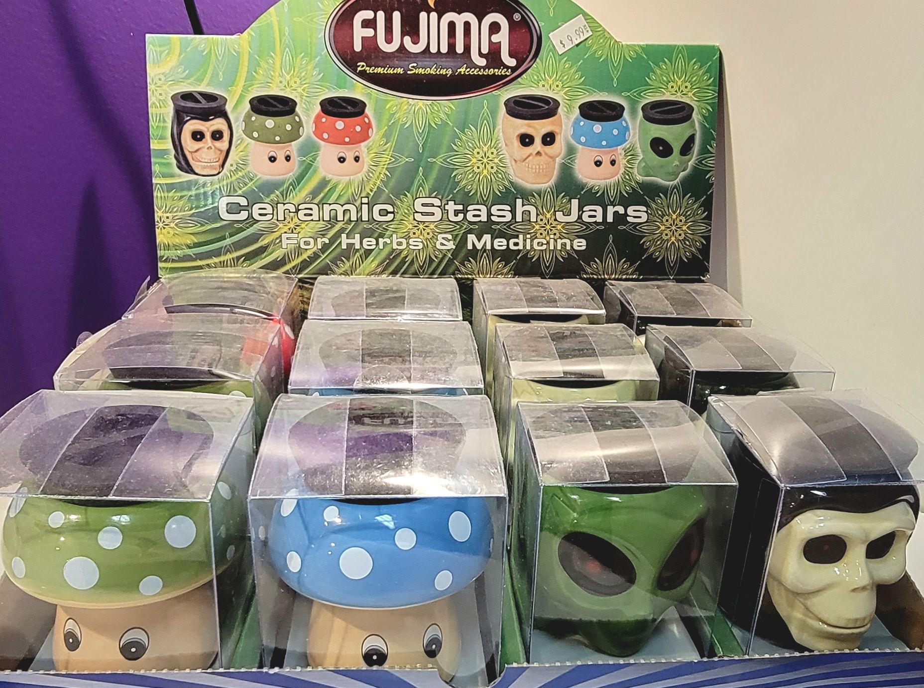 Display of ceramic stash jars in various character designs, for herbs and medicine.