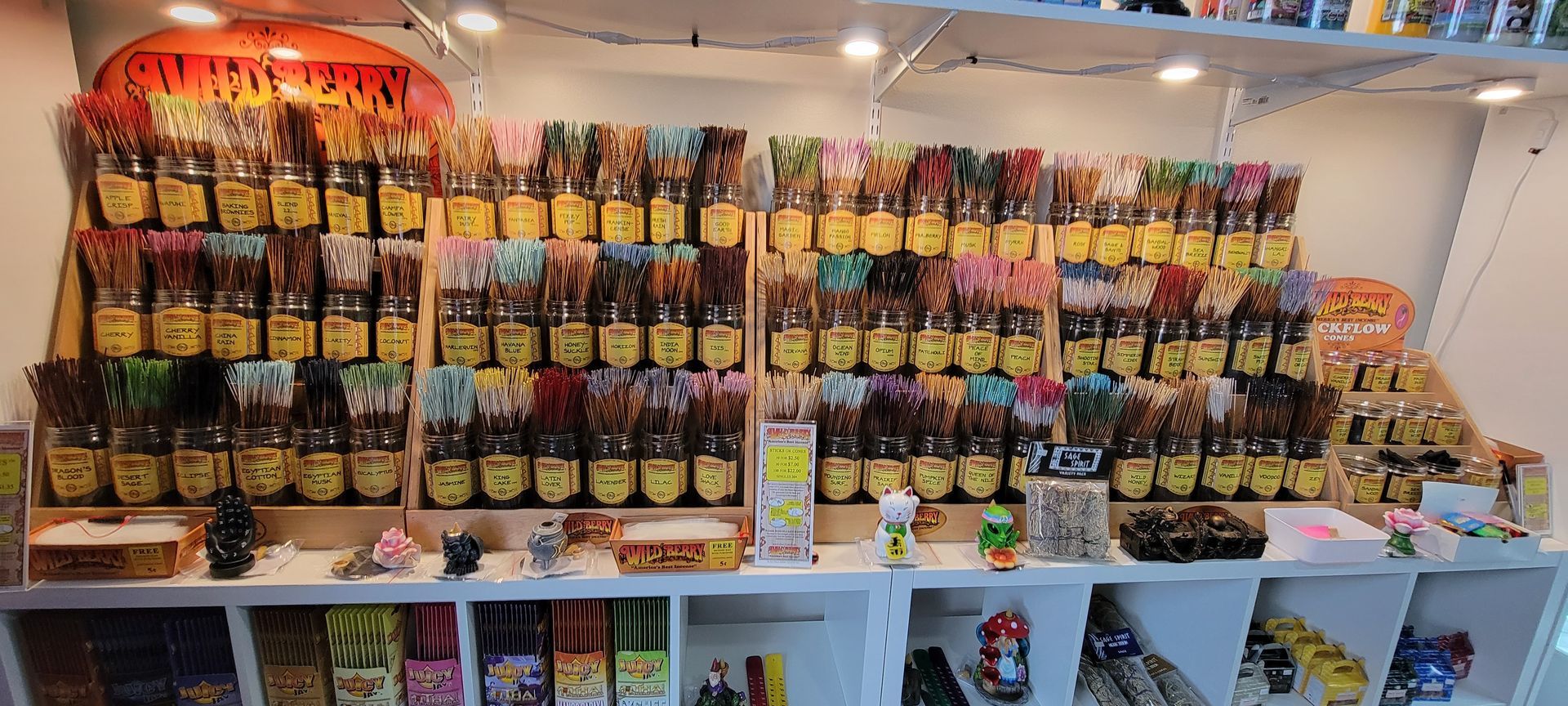 A shop display filled with various packaged treats, featuring rows of colorful products.