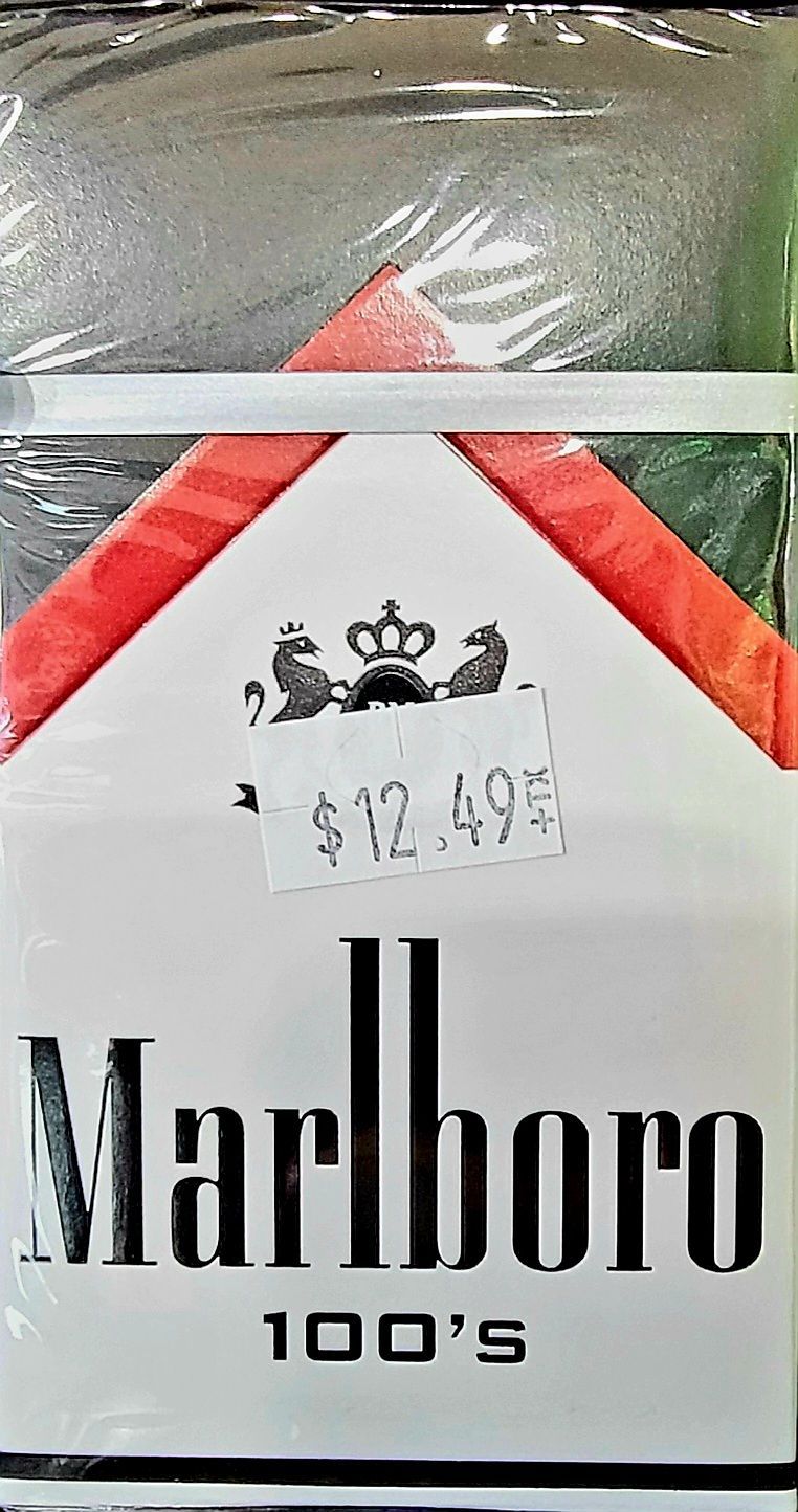Pack of Marlboro 100's cigarettes with a price sticker showing $12.49. White box with red and green accents.