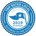 Blue “Top Rated Local” 2019 business award badge with a star and ribbon design