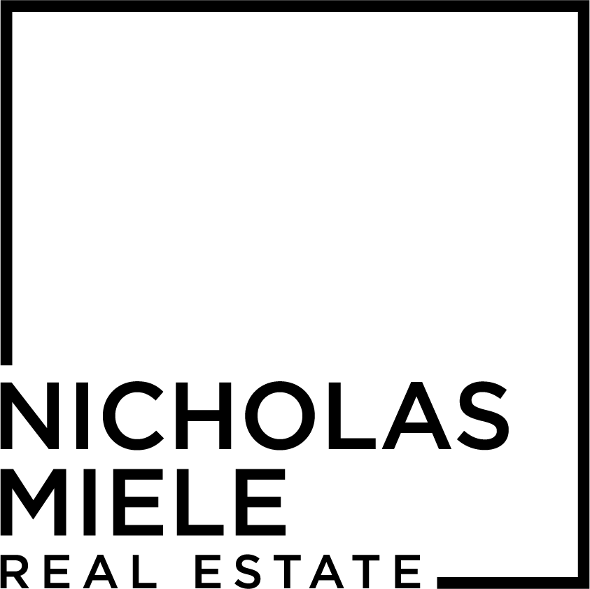 A black and white logo for nicholas miele real estate.