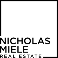 A black and white logo for nicholas miele real estate.