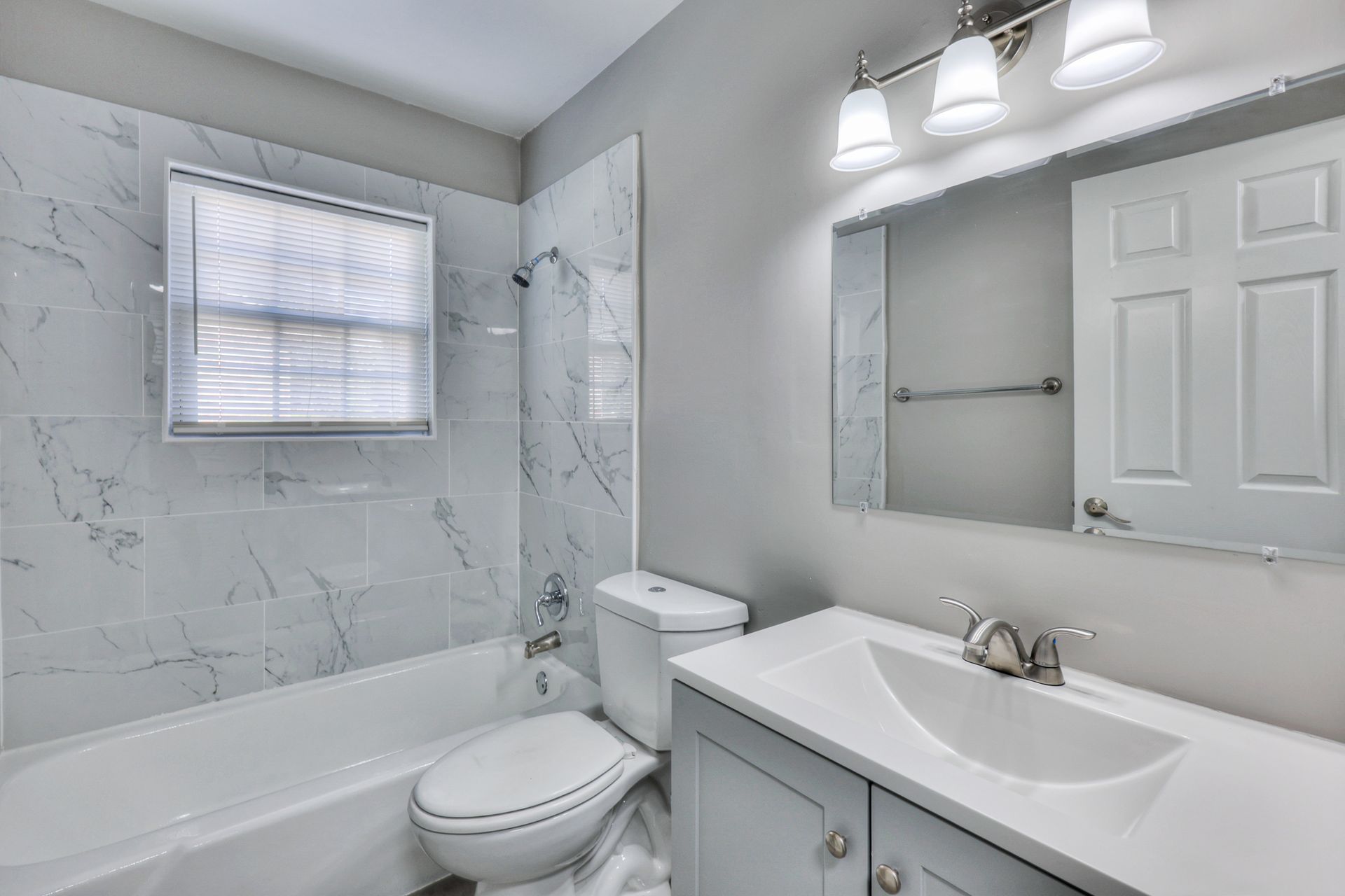 Photo of a bathroom with a tub/shower combination