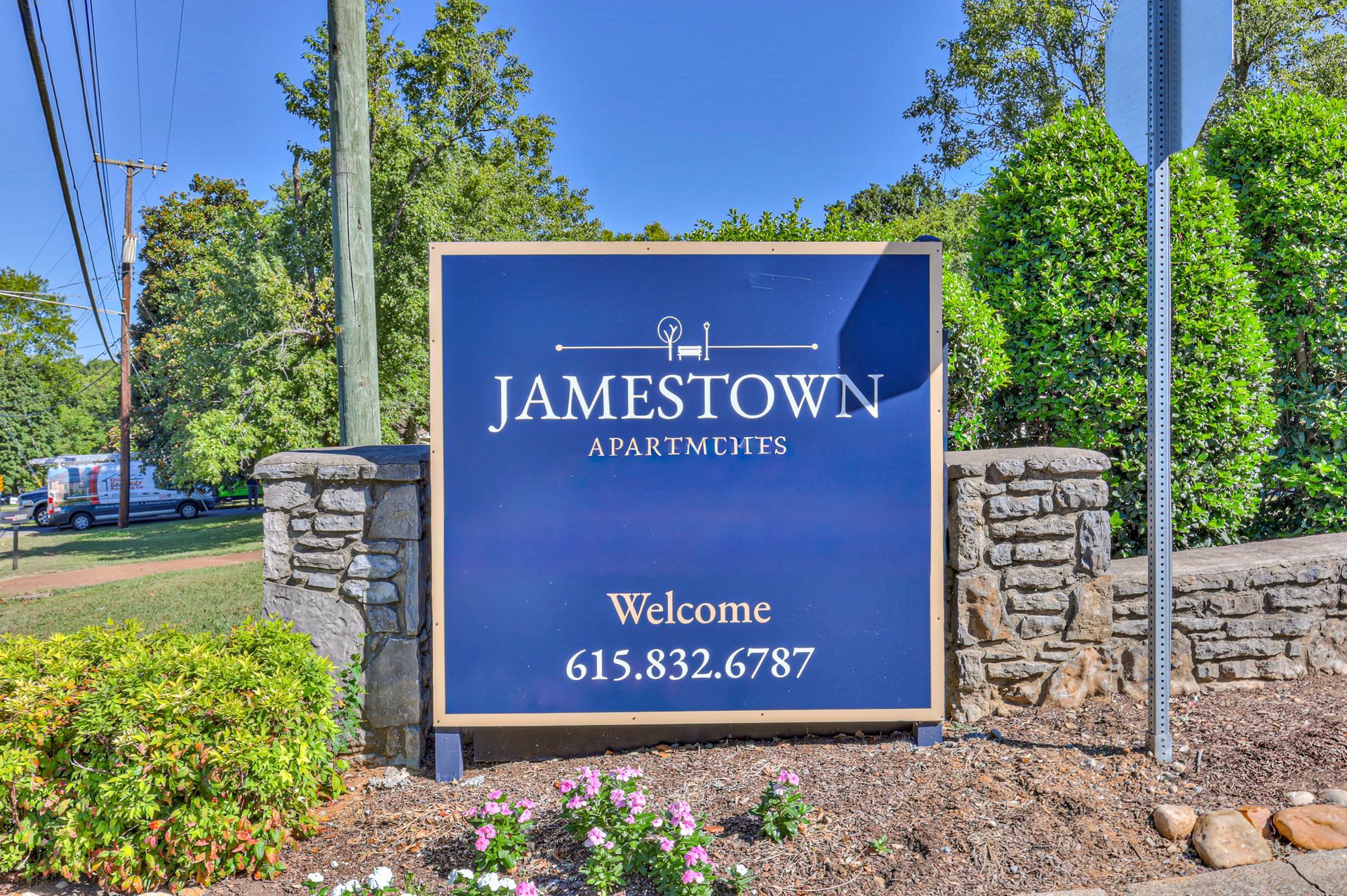 Photo of a community entrance sign, seen from a front facing angle