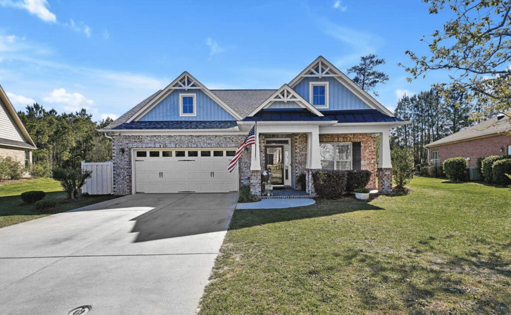 A large house with a large swimming pool in front of it.